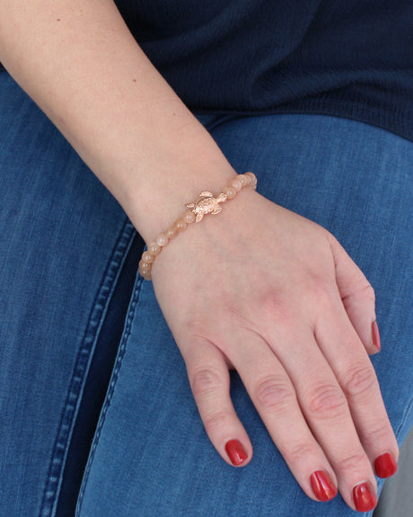 Meeresrauschen orangenes Mondstein Armband mit Turtle in der Länge 19,5 cm